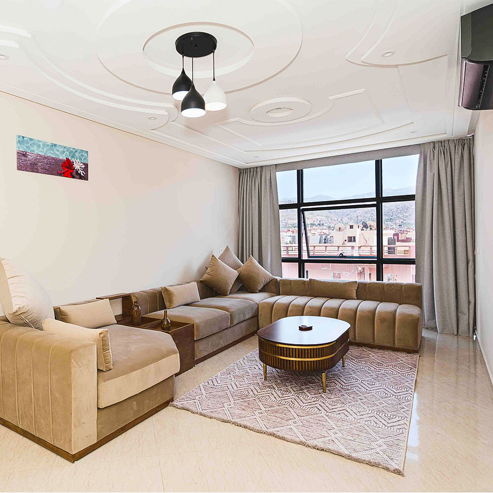 Luxury apartment living room with traditional Moroccan decor and modern amenities – Golden Sky Home Béni Mellal