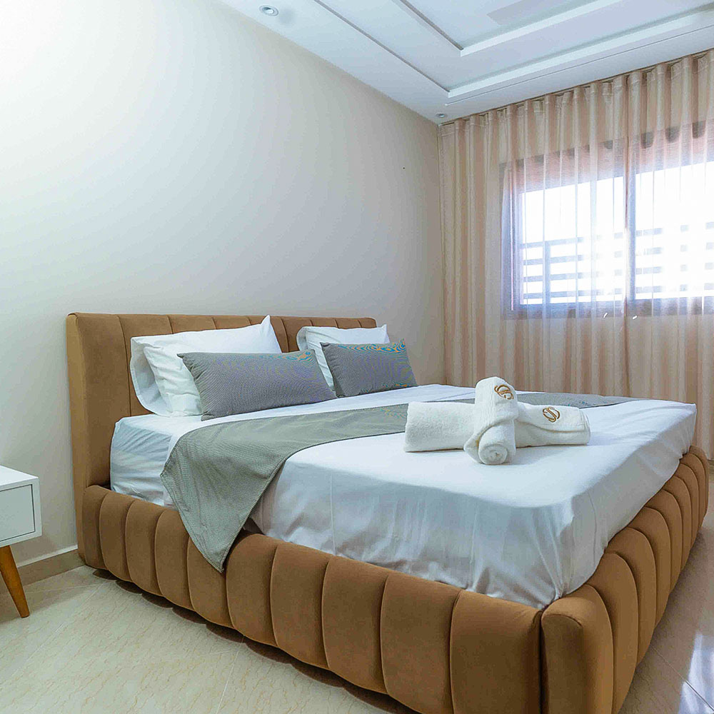 Room Lounge Area with traditional Moroccan seating and contemporary comfort – Golden Sky Home Béni Mellal