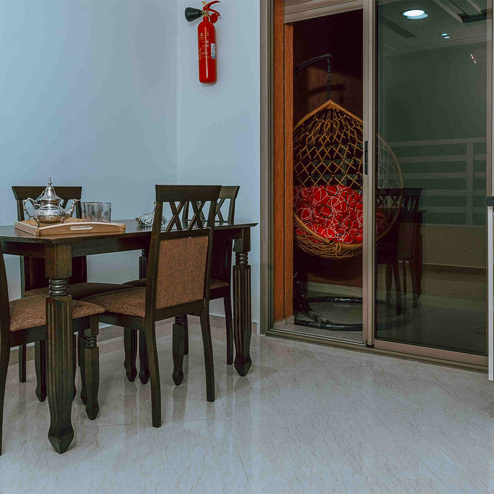Private balcony with mountain views and comfortable outdoor furniture – Golden Sky Home Béni Mellal