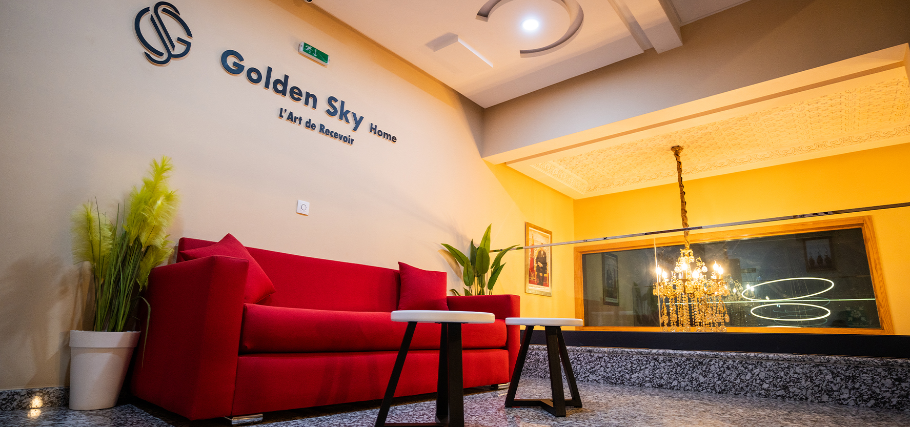 Golden Sky Home hospitality staff providing personalized service to guests in traditional Moroccan style